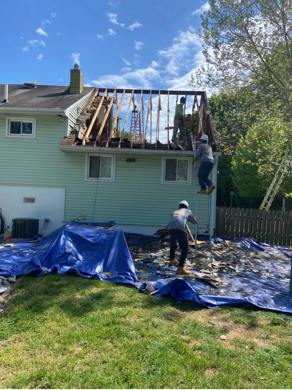 Kubat Construction crew framing an addition roof